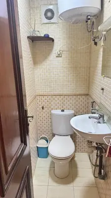 a small bathroom with a toilet and a sink at Diar 4 in Casablanca