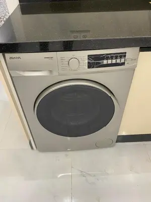 a washing machine is sitting in a kitchen at Chic city center studio in Casablanca