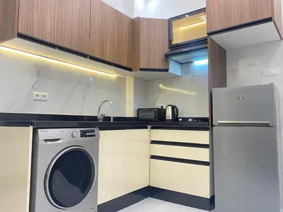 a kitchen with a washing machine in a kitchen at Chic city center studio in Casablanca
