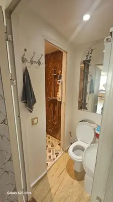 a bathroom with a toilet and a shower in it at Appartement de plage front de mer in Tamaris