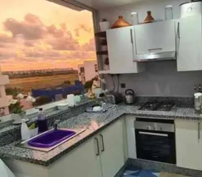 a kitchen with a sink and a counter top at Mansouria beach resort in Mohammedia
