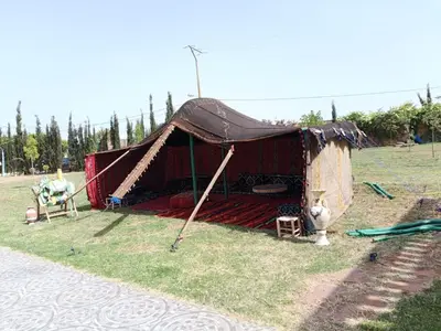 a large tent in the middle of a field at Ferme
