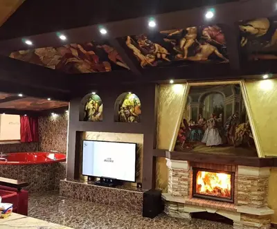 a living room with a fireplace and a television at Appartements journaliers et mensuels in Aïn Chock