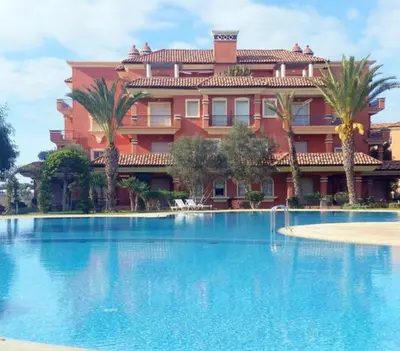 a large swimming pool in front of a building at Appartement du luxe au cœur du Golf in Bouznika