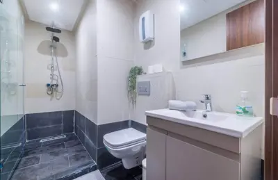 a bathroom with a toilet and a sink at Sunshine in Casablanca