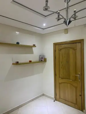 a room with a wooden door and a shelf at The Bright House in Casablanca