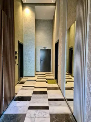 a hallway of a building with a door at Natura Living Apartment in Mohammedia