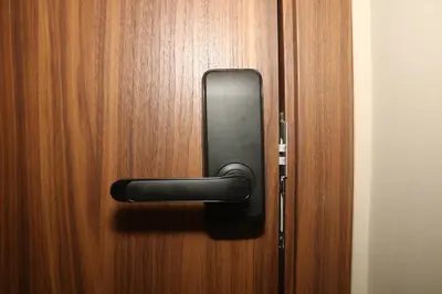 a black door handle on a wooden door at Luxurious and modern studio on Maarif-Franceville in Casablanca