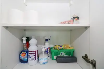 a shelf with bottles of cleaning products in a bathroom at Studio luxueux sur Val d'anfa in Casablanca