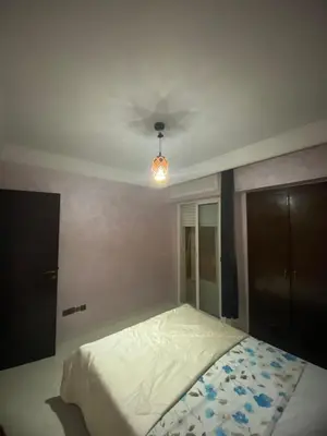 a bedroom with a bed with a ceiling at The White House in Casablanca