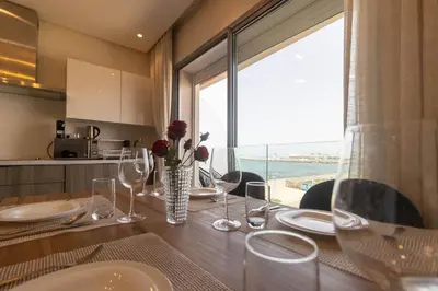 a dining room table with a view of the ocean at Terrasse Horizon Marina in Casablanca