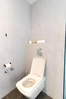 a bathroom with a white toilet in a room at Terrasse Horizon Marina in Casablanca