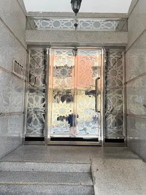 a door to a building with a glass door at Elégant appartement 2 Bedroom près de la plage Rabat in Rabat