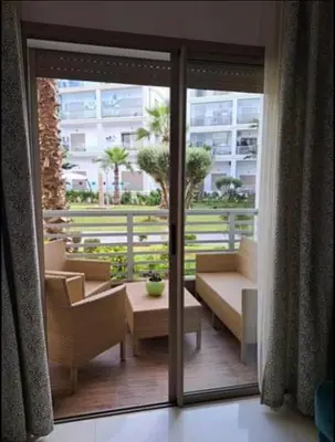 a balcony with a view of a building at Costa Beach 2 in Bouznika