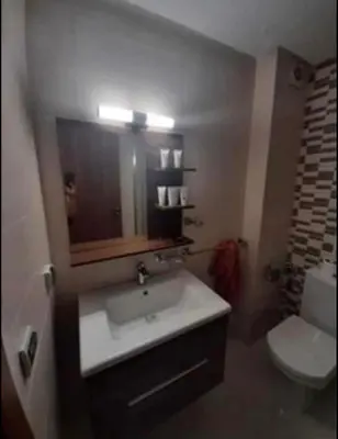 a bathroom with a sink and a toilet at Costa Beach 2 in Bouznika