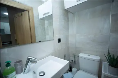 a bathroom with a sink and a toilet and a mirror at Where to stay in Casablanca 2 bedrooms in Casablanca