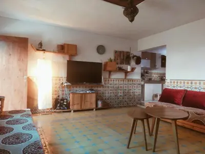 a living room with a couch and a table at Birds House in Casablanca