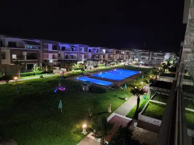 an aerial view of an apartment complex at night at Malaga el Mansouria valence in Casablanca