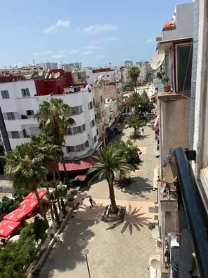 an overhead view of a city with palm trees and buildings at Un studio meublé agréable à Casablanca in Casablanca