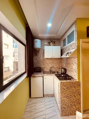 a small kitchen with a sink and a window at Cozy Studio in Casablanca in Casablanca