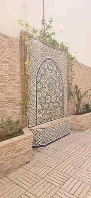 a wall with a gate with a pattern on it at La corniche in Casablanca