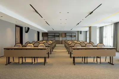 an empty conference room with chairs and tables at Le Meridien Casablanca in Casablanca