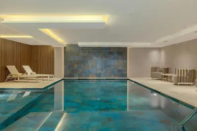 a swimming pool in a hotel with blue tiles at Le Meridien Casablanca in Casablanca