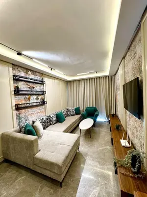 a living room with a couch and a table at Domus Studio - Ambiance Zen au cœur de Casablanca in Casablanca
