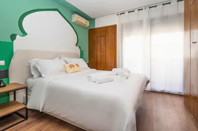 a bedroom with a white bed with towels on it at CASA B l'hôtel in Casablanca