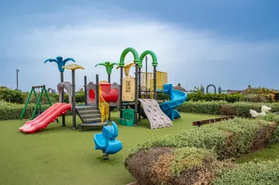 a park with a playground with a slide at Garden Bay Signature AppartHotel in Casablanca