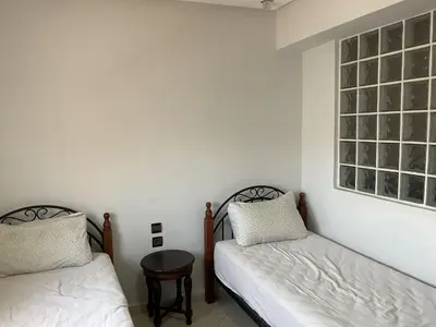 a room with two beds and a window at Casa fbelvedère in Casablanca
