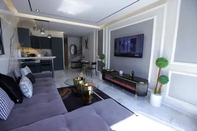 a living room with a couch and a table at Luxe Ghandi Casablanca in Casablanca