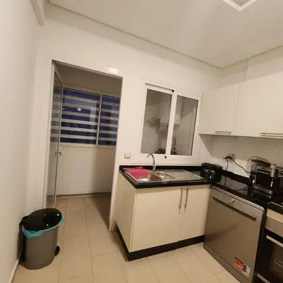 a kitchen with a sink and a counter top at Diana Ennour in Rabat