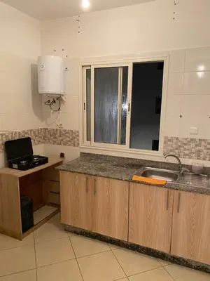 a kitchen with a sink and a counter with a window at Appartement à Skhirat in Skhirat