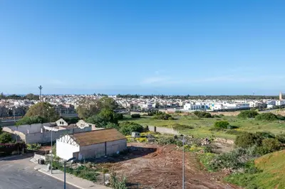 a view of a city from a hill with houses at Chic, bright, 2 BR apartment, panoramic view in Temara
