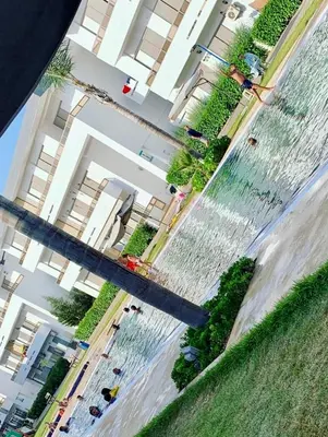 a view of a fountain in front of a building at Elegant & spacious with a view in Mansouria