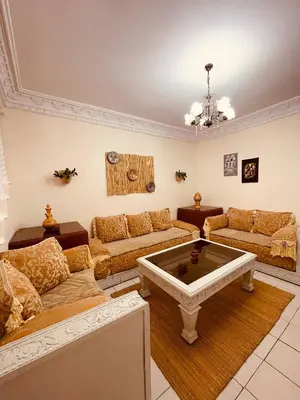 a living room with a couch and a table at Attractive Studio in Casablanca in Casablanca