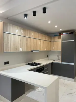 a kitchen with a white counter top and a refrigerator at Casawi in Casablanca