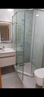 a bathroom with a shower and a sink and a toilet at Suites au sein d'une Villa au centre ville de Rabat in Rabat