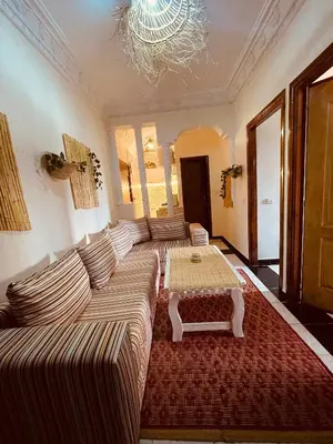 a living room with a couch and a table at Beautiful Studio in Casablanca in Casablanca