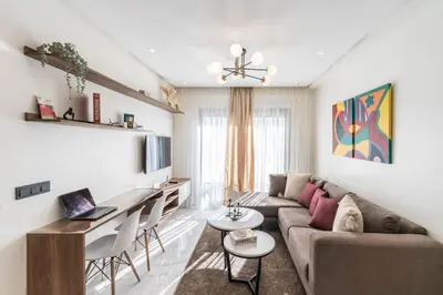 a living room with a couch and a table at Studio palmier TR3 in Casablanca