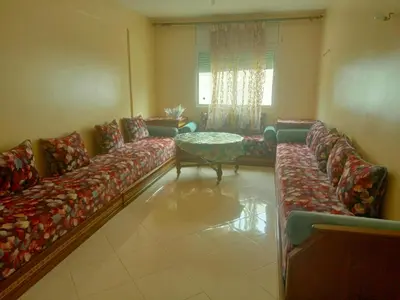 a large living room with couches and a table at Casa sabir in Temara