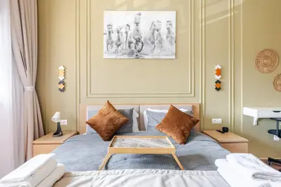 a bedroom with a bed with a table on it at Cozy studio 5 min Casa port Parking Netflix in Casablanca