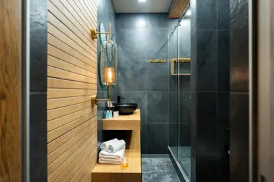 a bathroom with a shower with a glass door at El home del belbala in Casablanca
