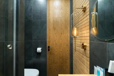 a bathroom with a toilet and a sink and a mirror at El home del belbala in Casablanca
