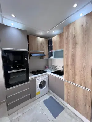 a kitchen with a washer and a washing machine at Appartement fraichement rénové à Agdal in Rabat