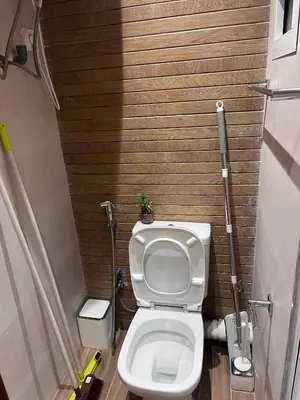 a small bathroom with a toilet with a plant on it at Appartement fraichement rénové à Agdal in Rabat