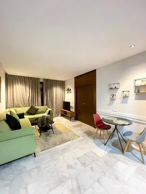 a living room with a couch and a table at A102 Studio cosy & chic in Casablanca