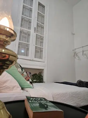 a bedroom with a bed and a window at Cosy 2BR in Heart of Casablanca in Casablanca