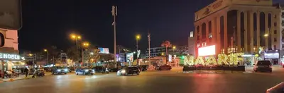 a busy city street at night with cars and buildings at Maârif Penthouse in Casablanca